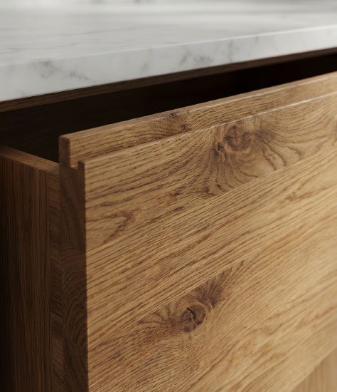 Detalle de cajón de madera de roble con encimera de mármol